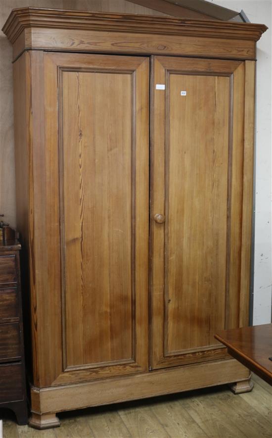 A Victorian pitch pine two door wardrobe W.149cm